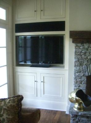 We custom built the black screen to conceal the front three speakers.