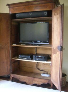 The owner of this beautiful French antique did not want any holes drilled in it.  Had to find creative way to get cabling into it through an existing hole in the back.