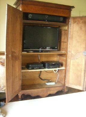The owner of this beautiful French antique did not want any holes drilled in it.  Had to find creative way to get cabling into it through an existing hole in the back.