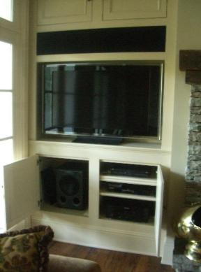 We custom built the black screen to conceal the front three speakers.