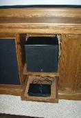 Center channel with slide out shelf for game station.
